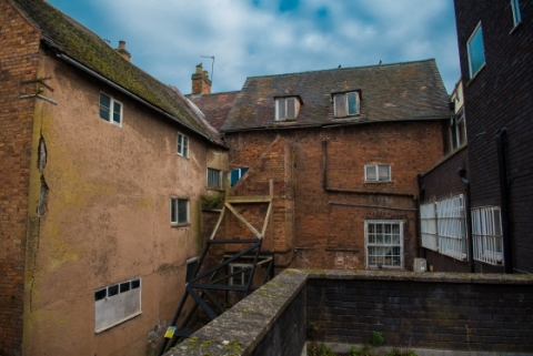 behind some derelict buildings