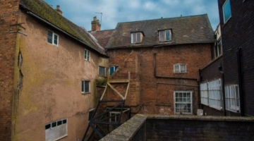 behind some derelict buildings