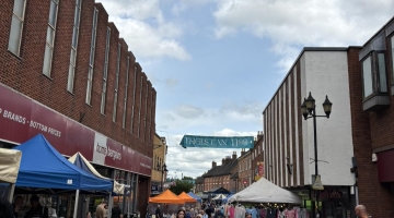 street with market stalls and people