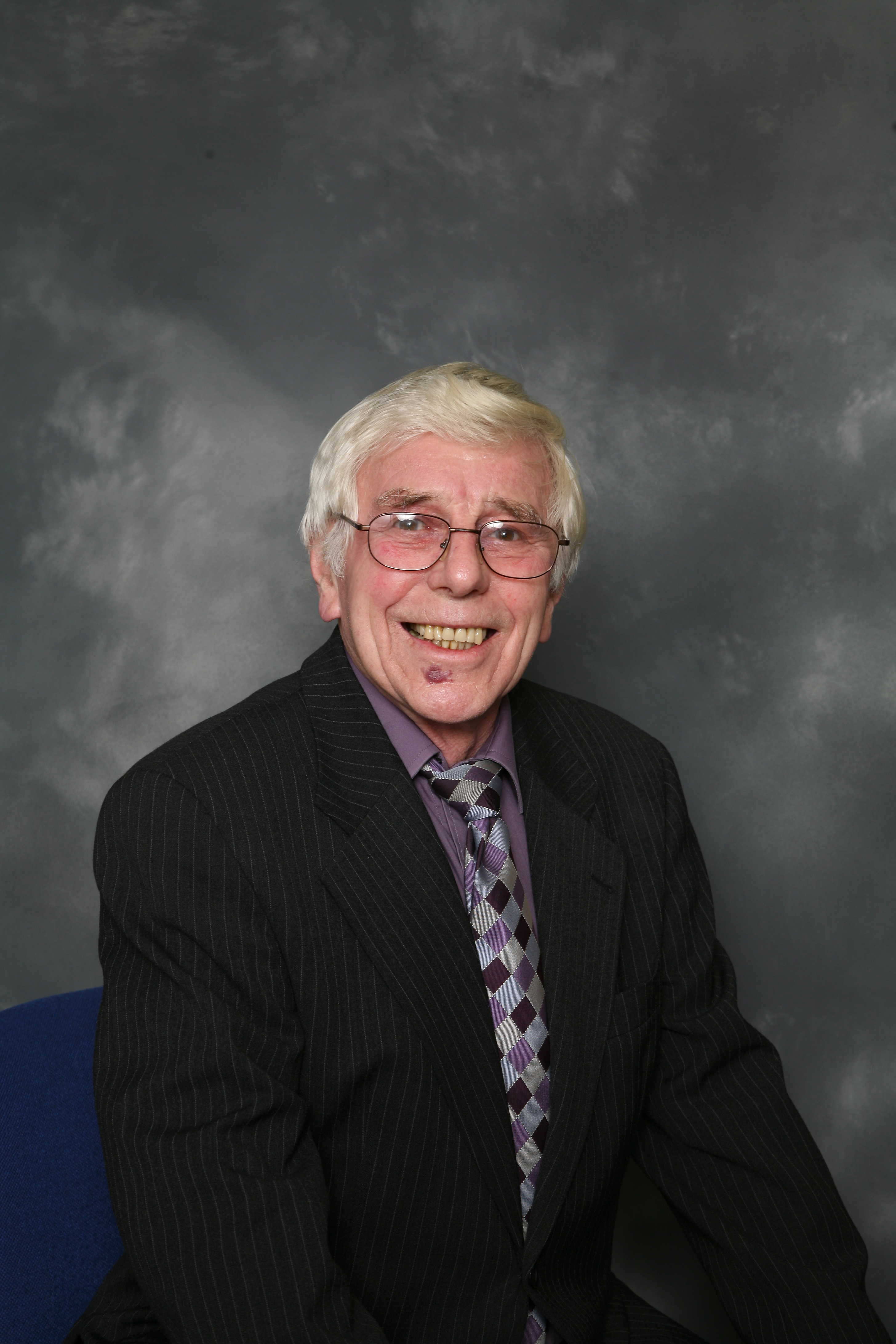 Ron Cook in a suit
