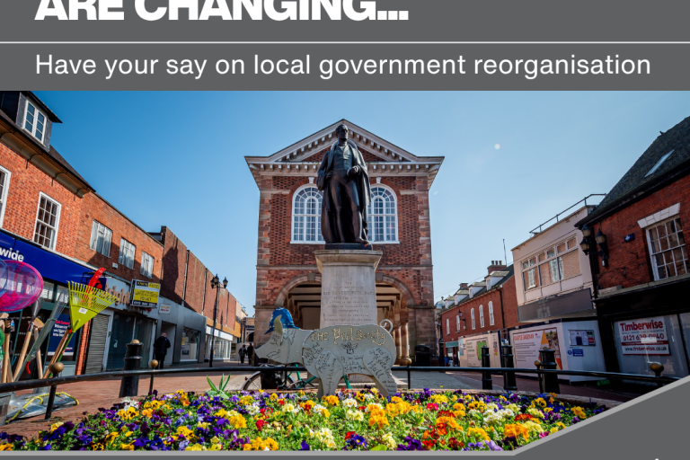 Tamworth Town Hall on a poster stating that local services are changing