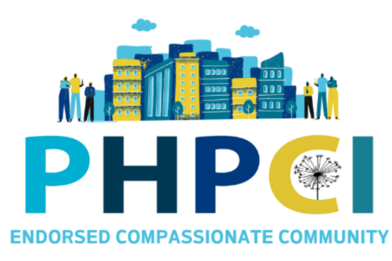 logo for compassionate community statue shows blue and green buildings and text
