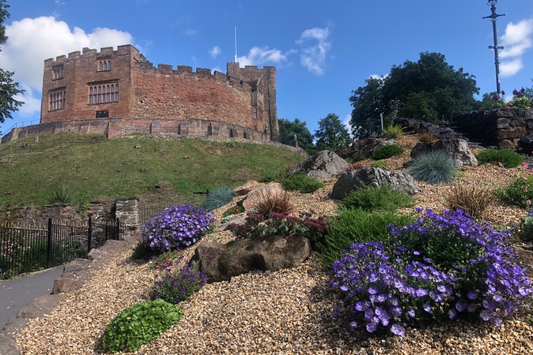 Tamworth Castle behind flower beds with purple and green flowers
