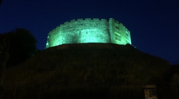 image of the castle lit-up green