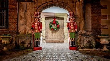 castle door at Christmas with nutcracker statues